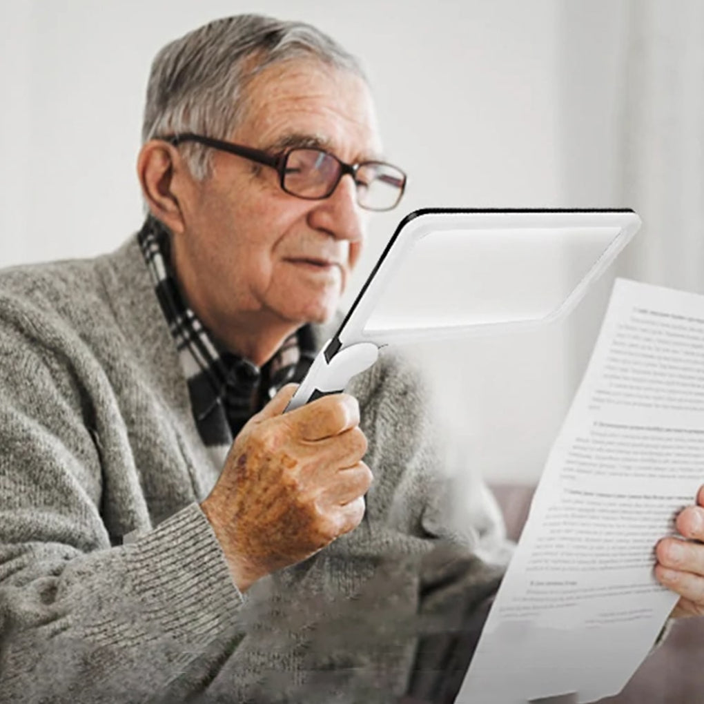 Large handheld magnifying glass for effortless reading, a helpful vision aid for seniors.