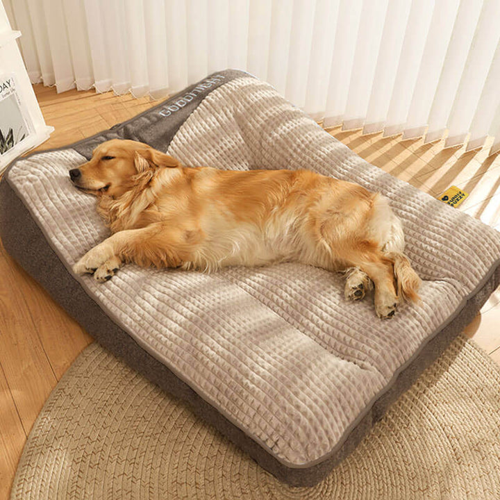 Orthopedic dog cushion for large breeds, designed with supportive memory foam & headrest to relieve joint pain.