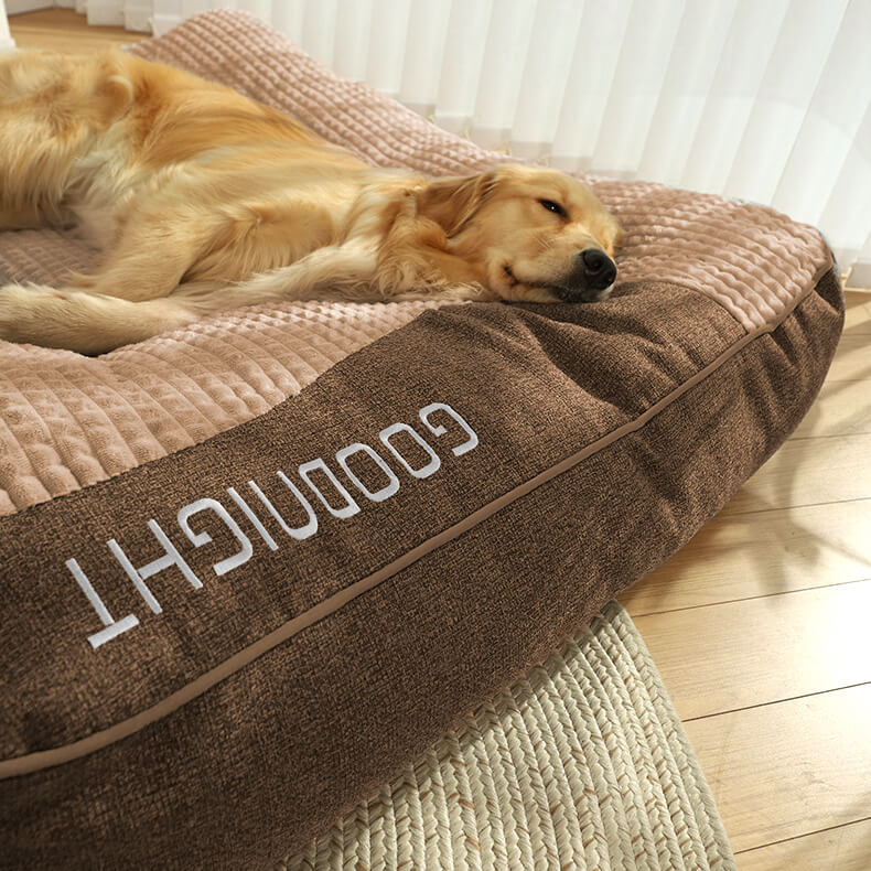 Washable large orthopedic dog bed with memory foam & headrest, ensuring hygiene and comfort for your pet.