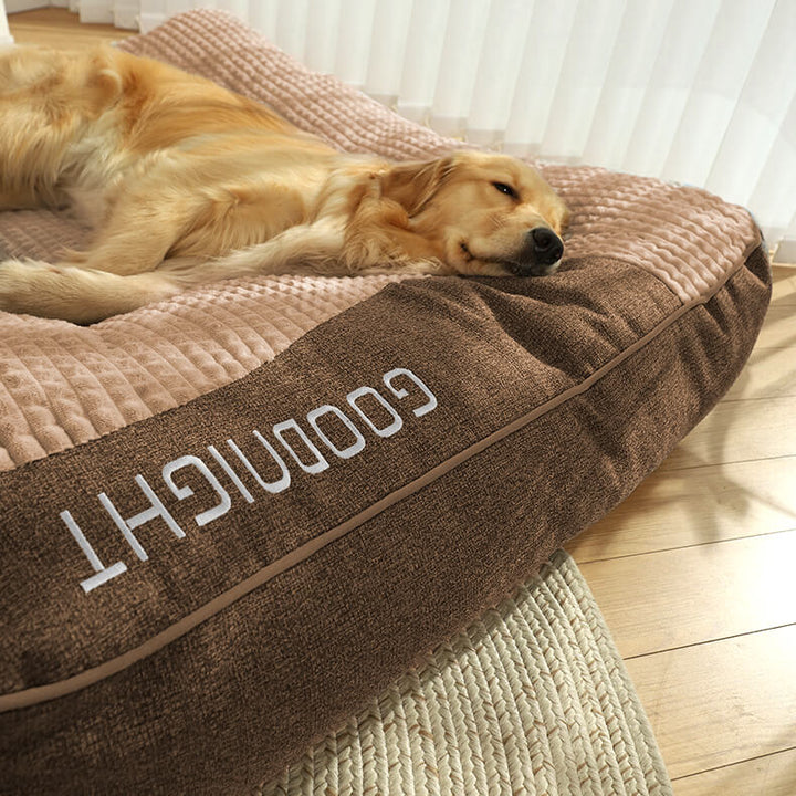 Washable large orthopedic dog bed with memory foam & headrest, ensuring hygiene and comfort for your pet.