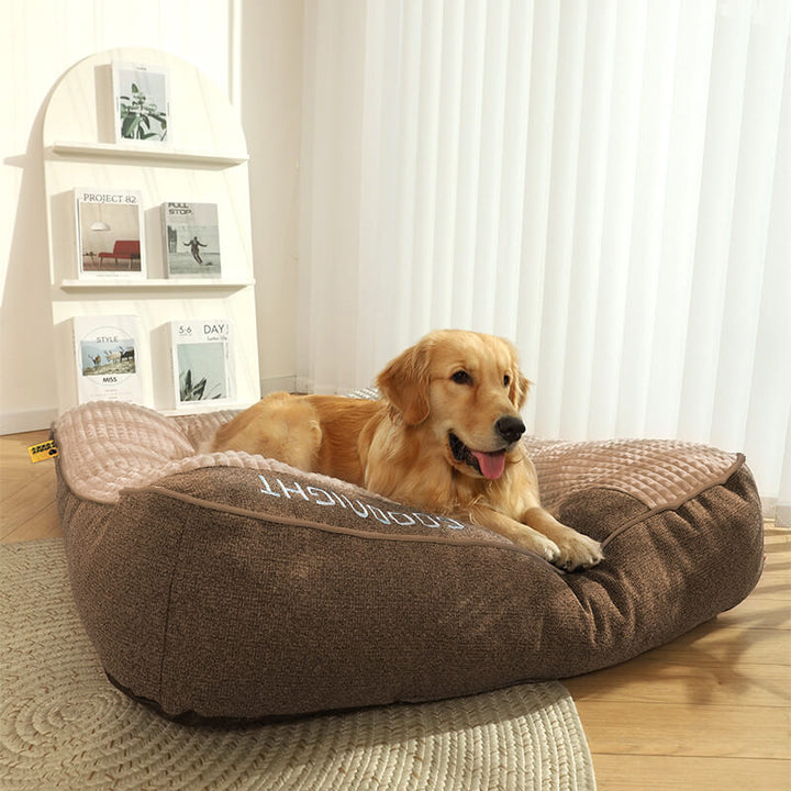Stylish large dog bed with soft velvet cover, memory foam core & comfortable headrest for luxurious pet comfort.