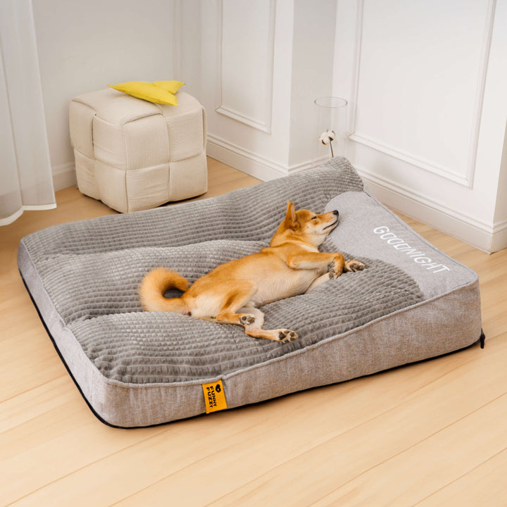 Dog cushion with therapeutic memory foam & integrated headrest, offering orthopedic support for large senior dogs.