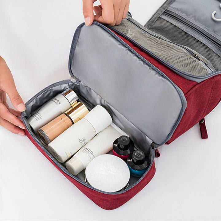 Essential unisex travel kit, a large hanging toiletry bag with multiple pockets for organized packing.
