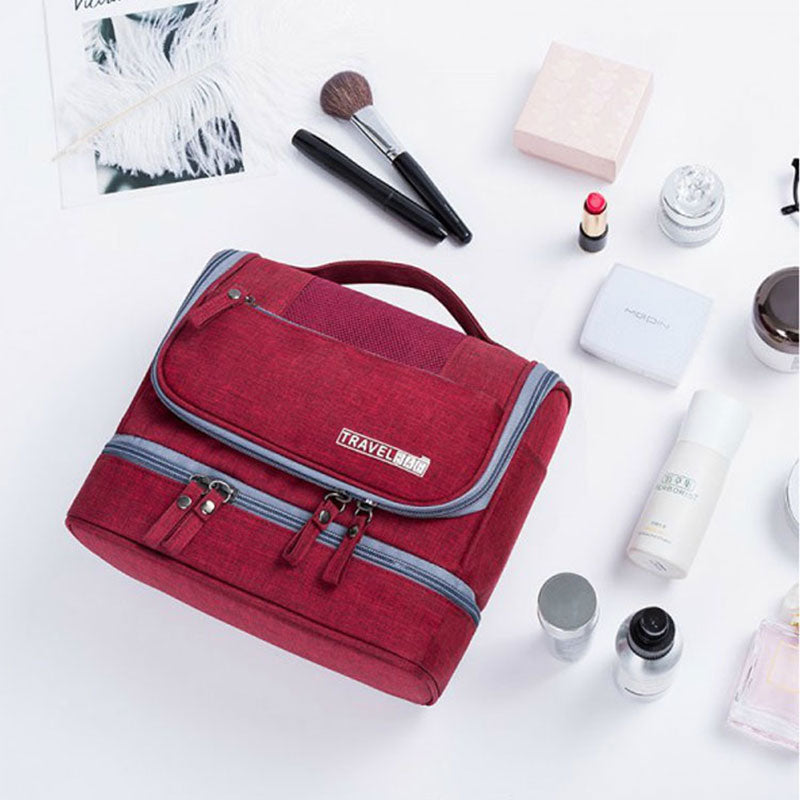 Foldable hanging travel bag, a multi-compartment organizer for toiletries, makeup & accessories.