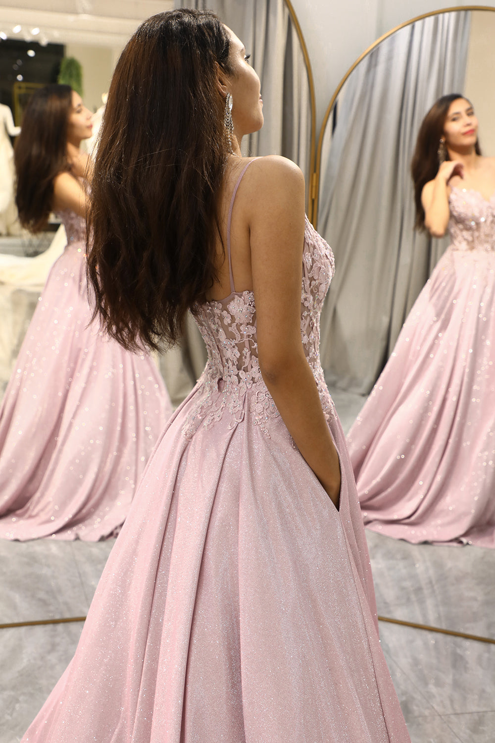 Elegant women's embellished maxi dress in light pink, perfect as a wedding guest or party dress.