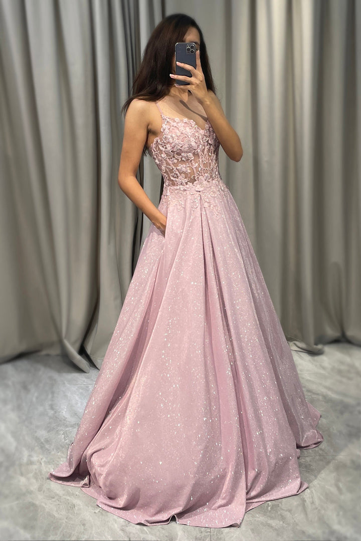 Full-length view of a radiant light pink embellished maxi dress, a stunning women's formal gown.