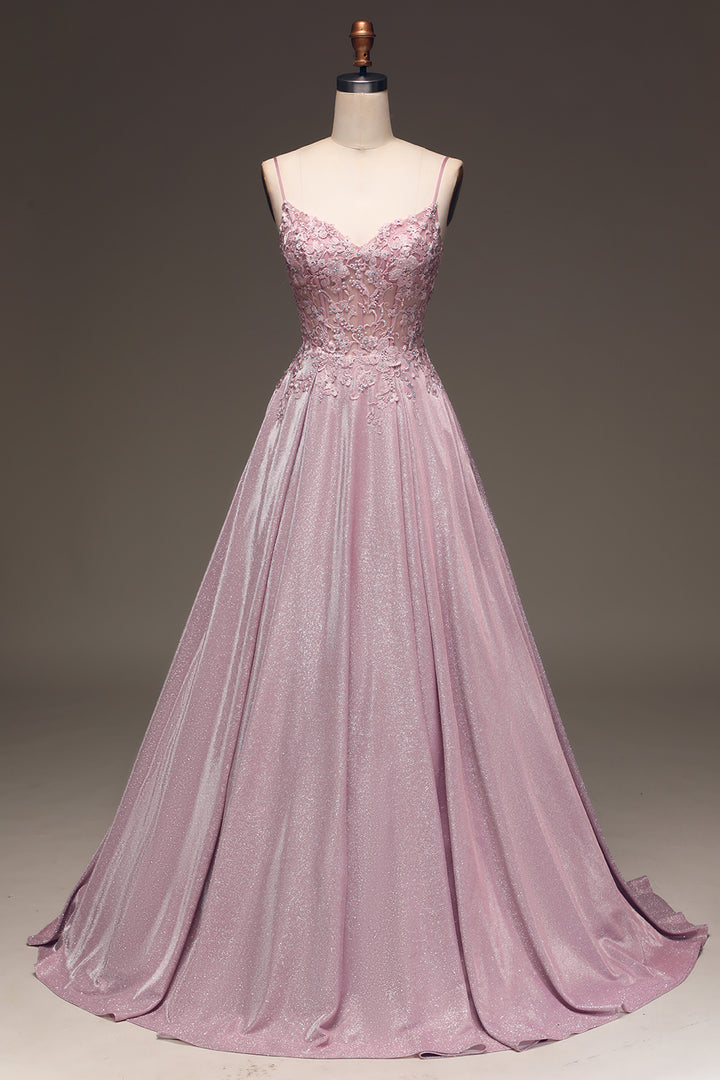 Back view of a light pink embellished maxi dress, showcasing its elegant design for wedding guests.