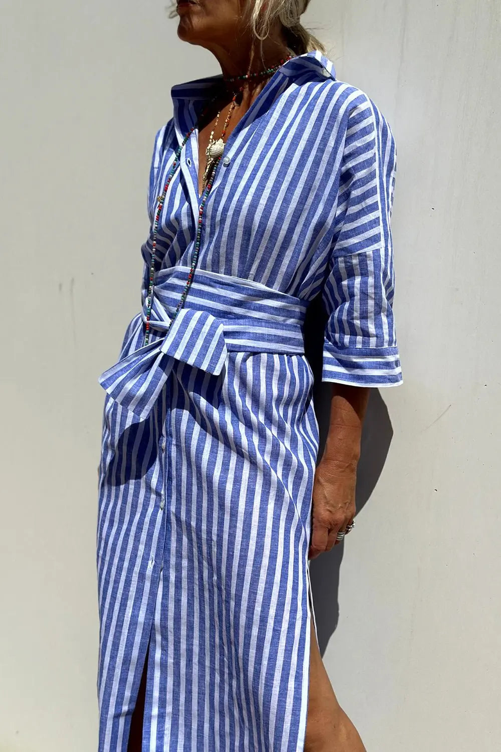 Chic striped midi shirt dress for women, featuring a button-down design, perfect for autumn winter layering.