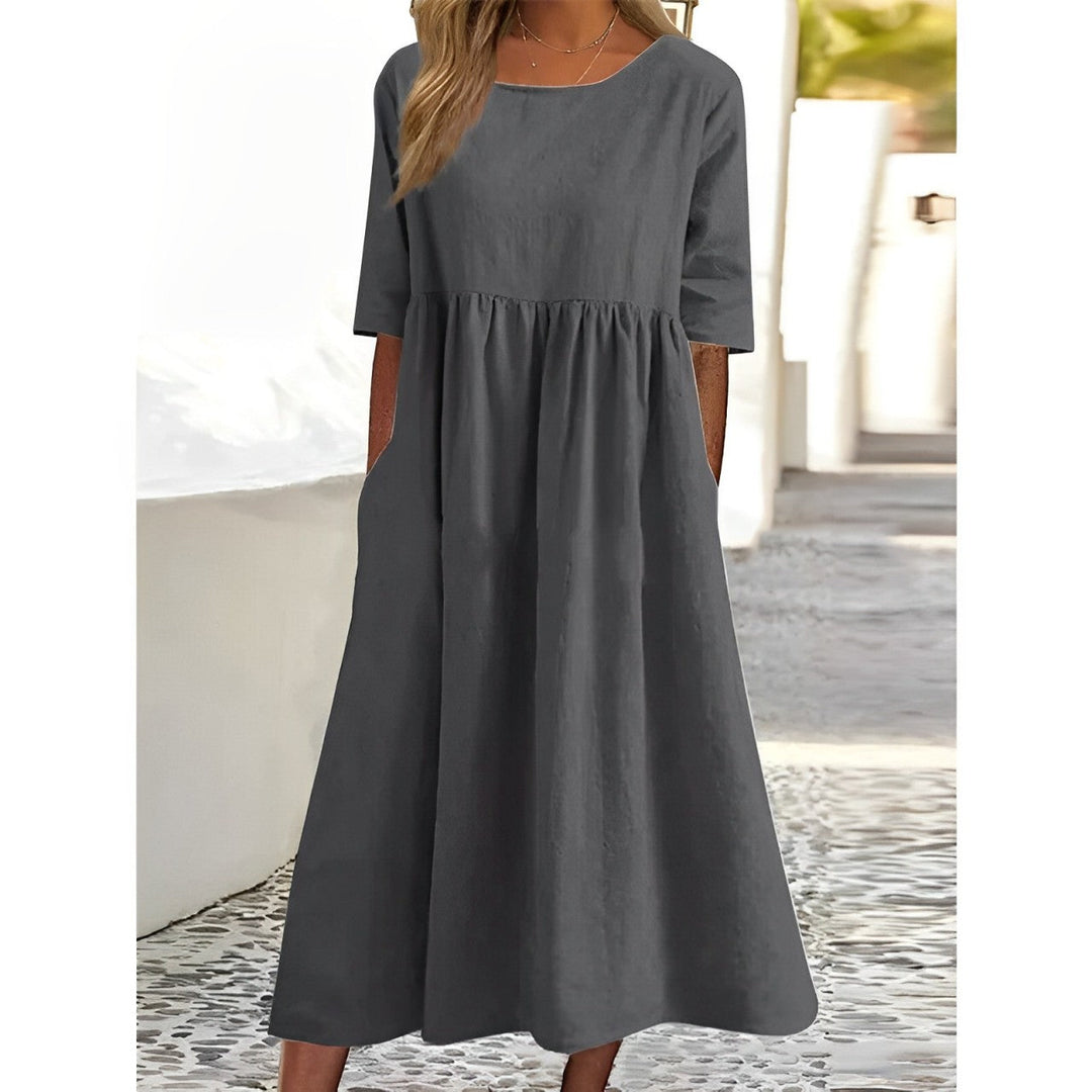 Effortless midi dress for women, offering a comfortable casual style suitable for everyday wear or elegant occasions.