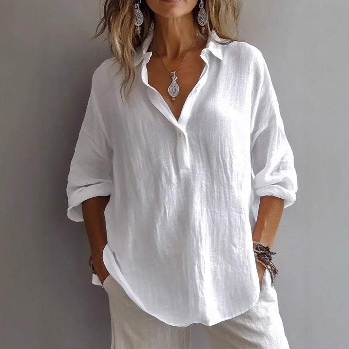 Loose fit women's button-down shirt with wide sleeves, comfortable everyday casual top for spring.