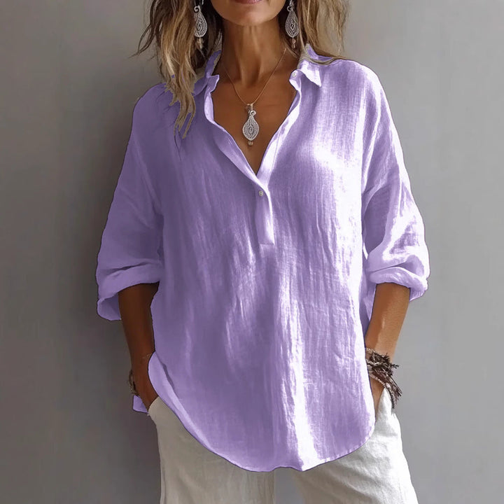 Comfortable women's loose fit button-down top, long sleeves, great for everyday casual style.