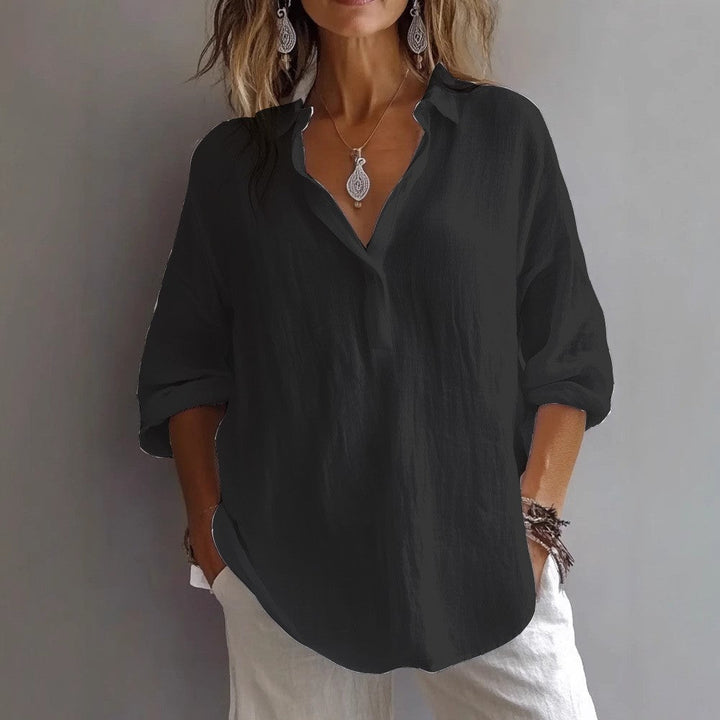 Women's chic loose fit button-down shirt with wide sleeves, a comfortable spring/summer blouse.