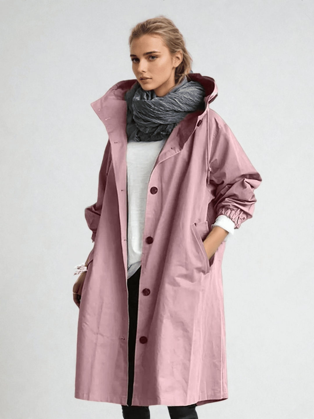 Close-up of a women's water-repellent trench coat. Features classic design, perfect as elegant & stylish long outerwear.