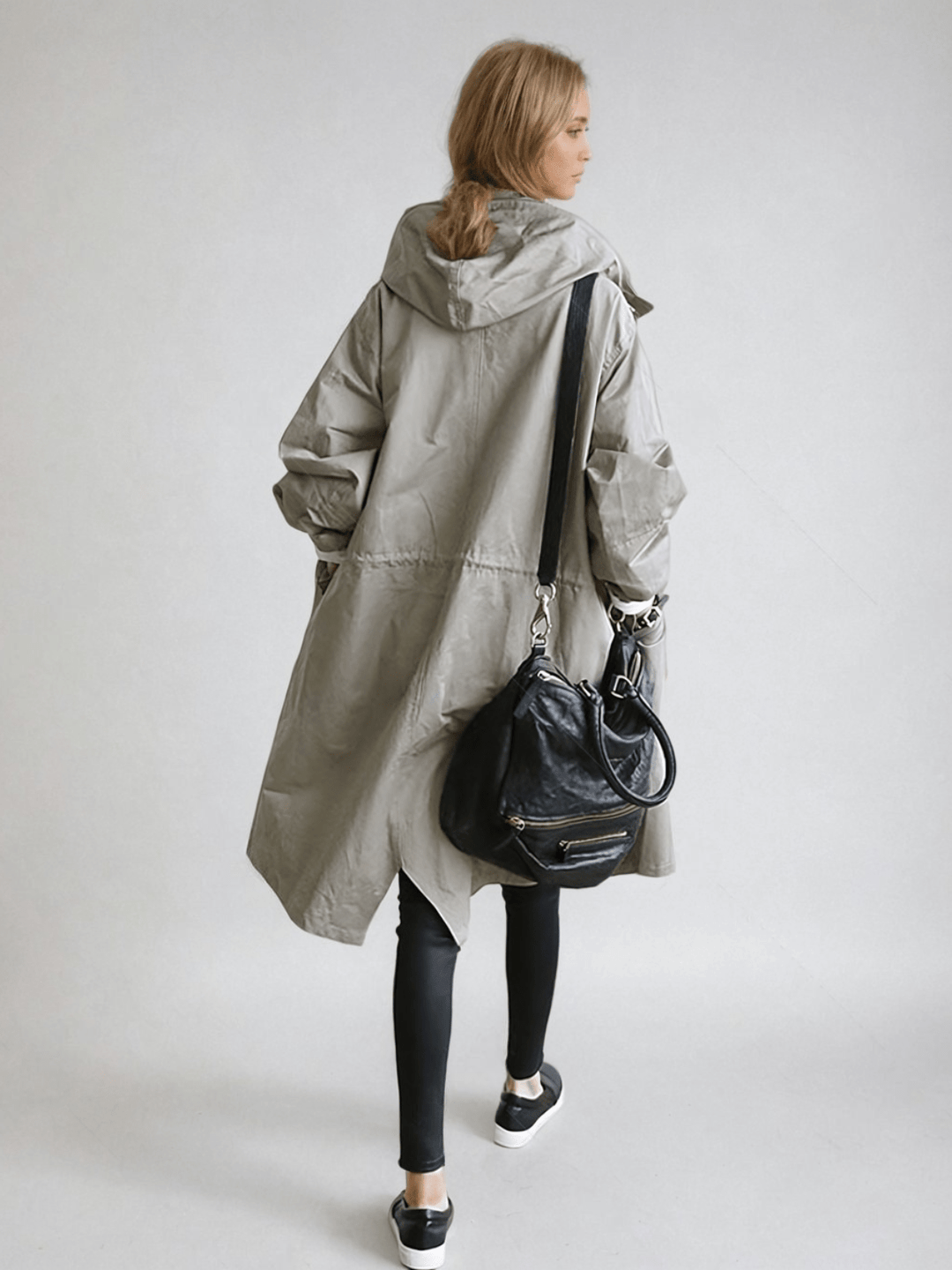 Classic women's long trench coat with a stylish cut. Water-repellent fabric for elegant, all-weather outerwear.