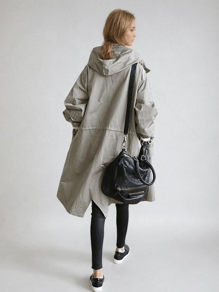 Classic women's long trench coat with a stylish cut. Water-repellent fabric for elegant, all-weather outerwear.