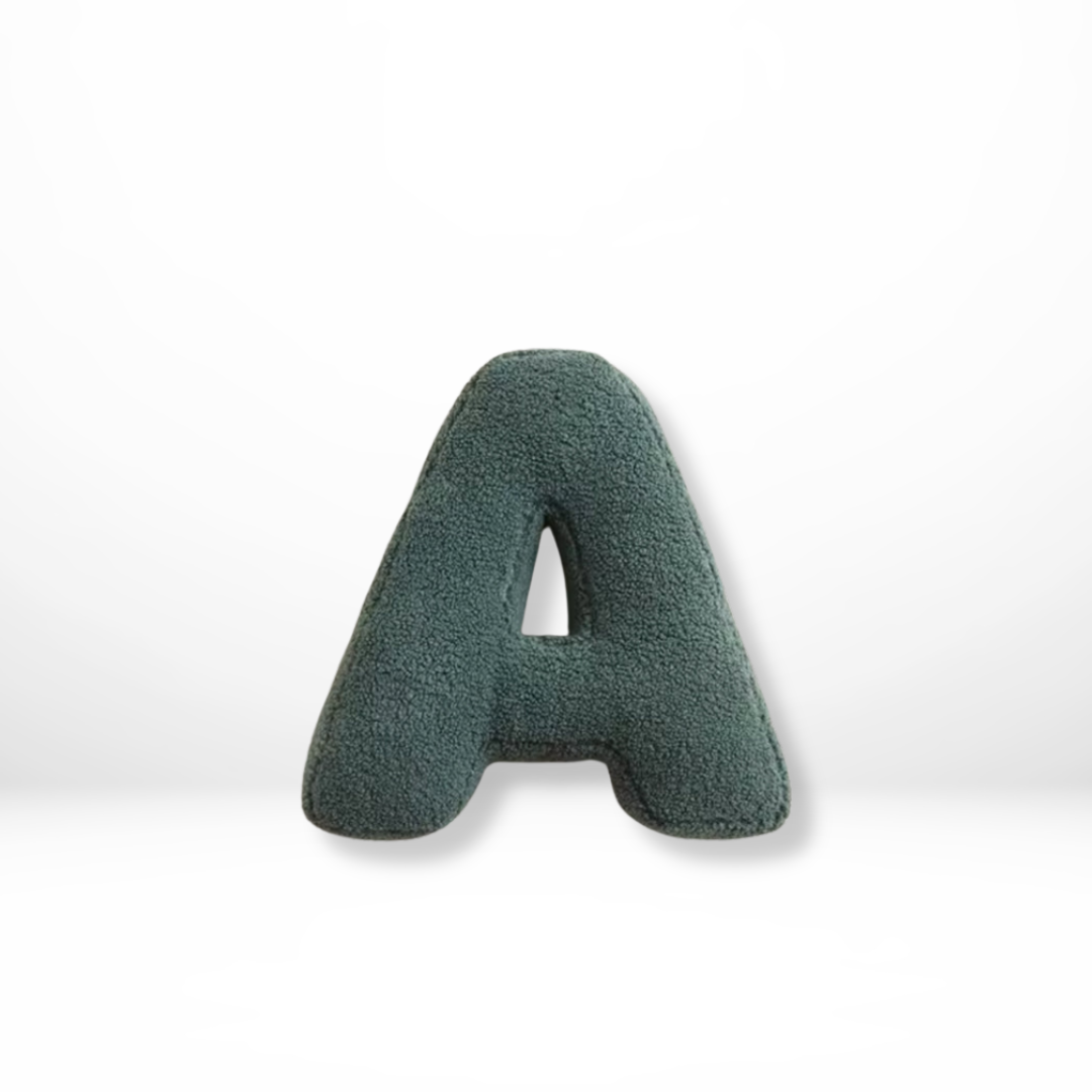 Luxurious velvet alphabet cushion, perfect for stylish home decor.