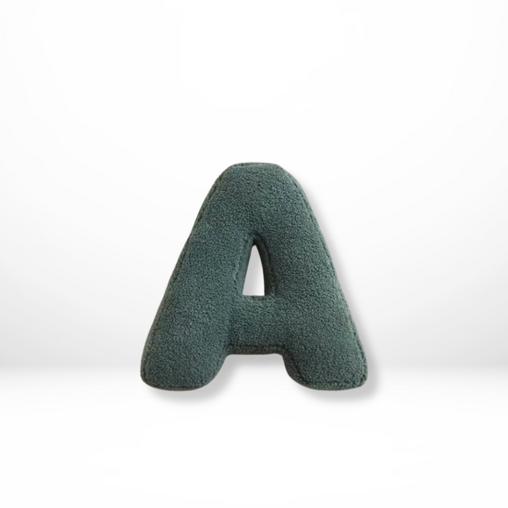 Luxurious velvet alphabet cushion, perfect for stylish home decor.