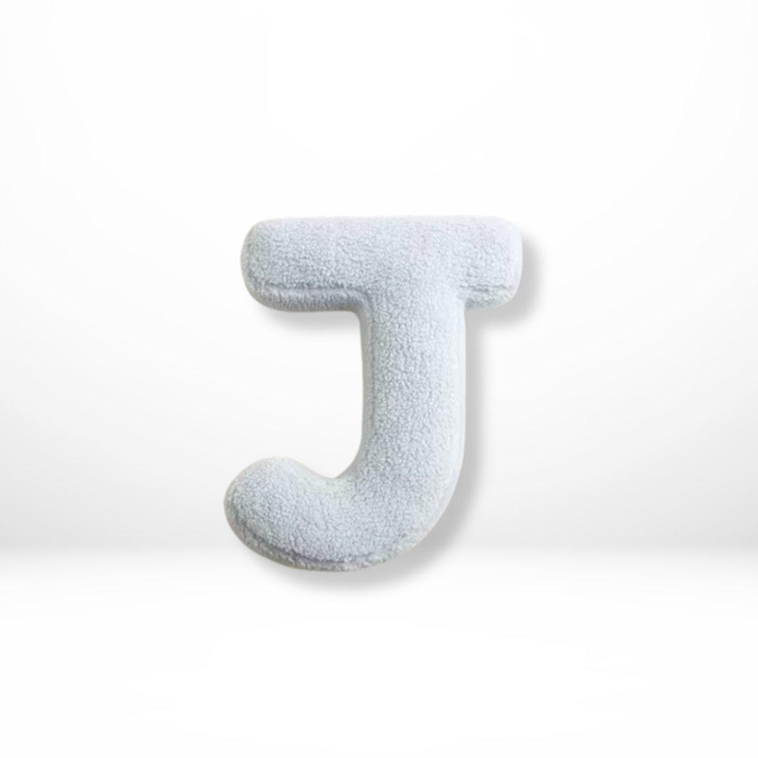 Modern velvet alphabet throw cushion, adds a stylish statement to any interior.