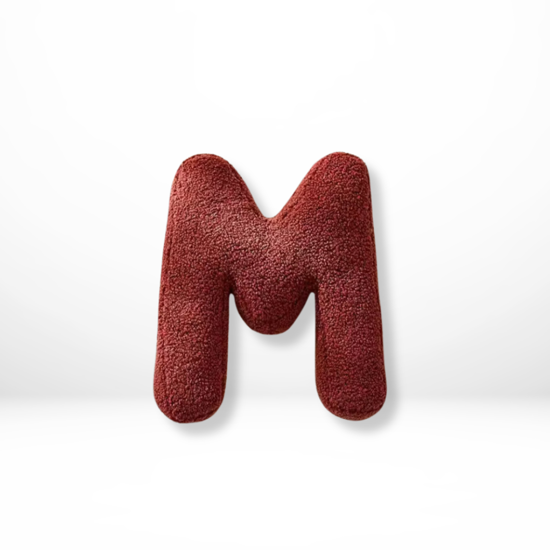 Elegant initial velvet pillow, a soft and luxurious accent for your sofa.