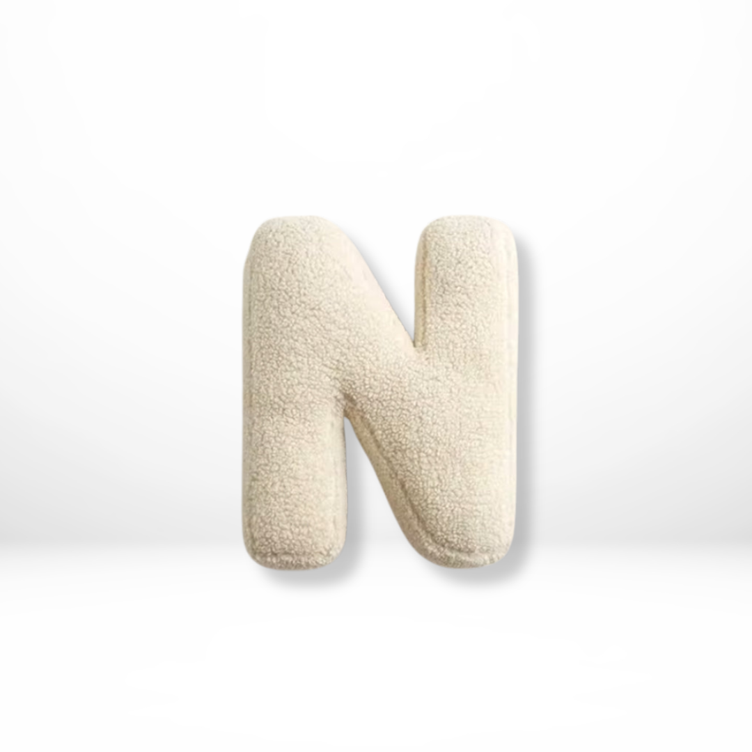 Stylish velvet letter throw pillow, ideal for adding a personalized flair to rooms.
