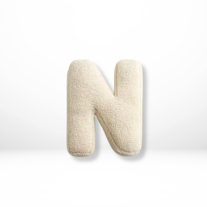 Stylish velvet letter throw pillow, ideal for adding a personalized flair to rooms.