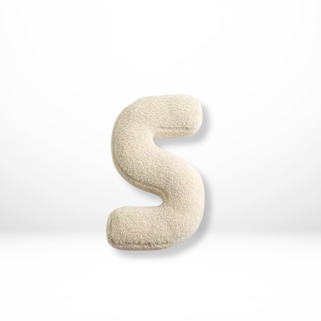 Soft-touch velvet alphabet throw pillow, great for personalized children's rooms.