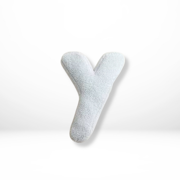 Modern velvet decorative cushion, with an initial for a personalized home accent.