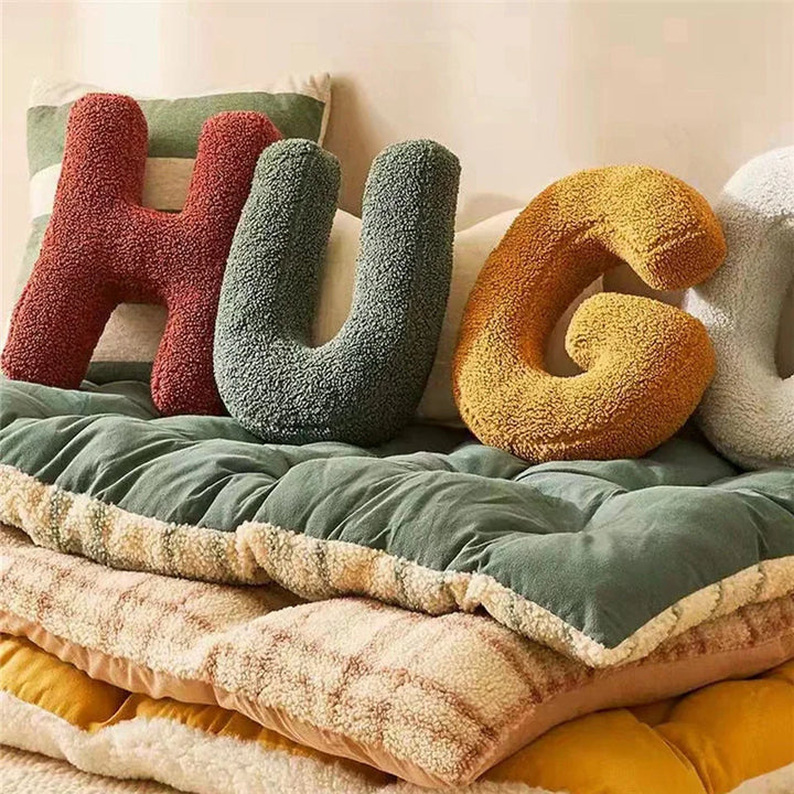Elegant velvet letter cushion, ideal as a unique throw pillow for living rooms.