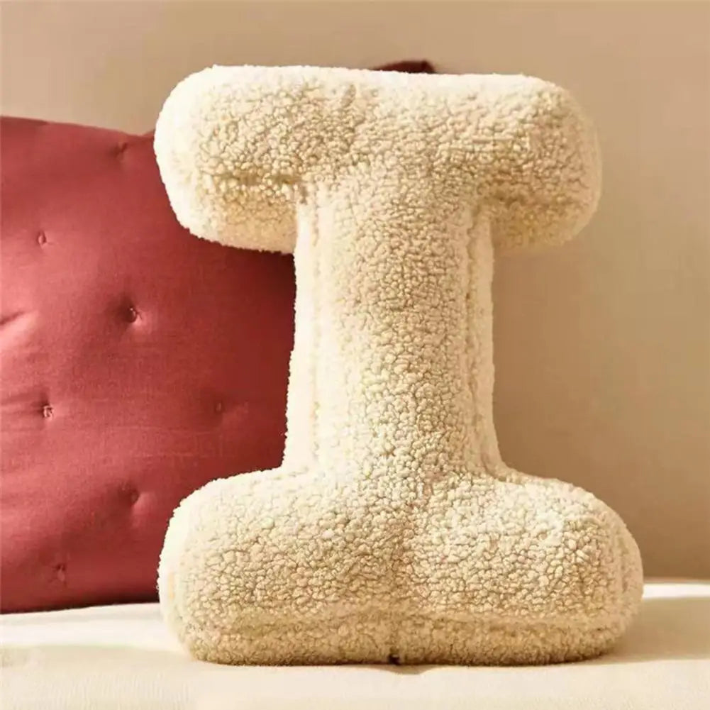 Decorative velvet initial cushion, adds a cozy, soft touch to home interiors.
