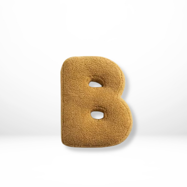 Stylish velvet alphabet pillow, a sophisticated accent for modern home decor.