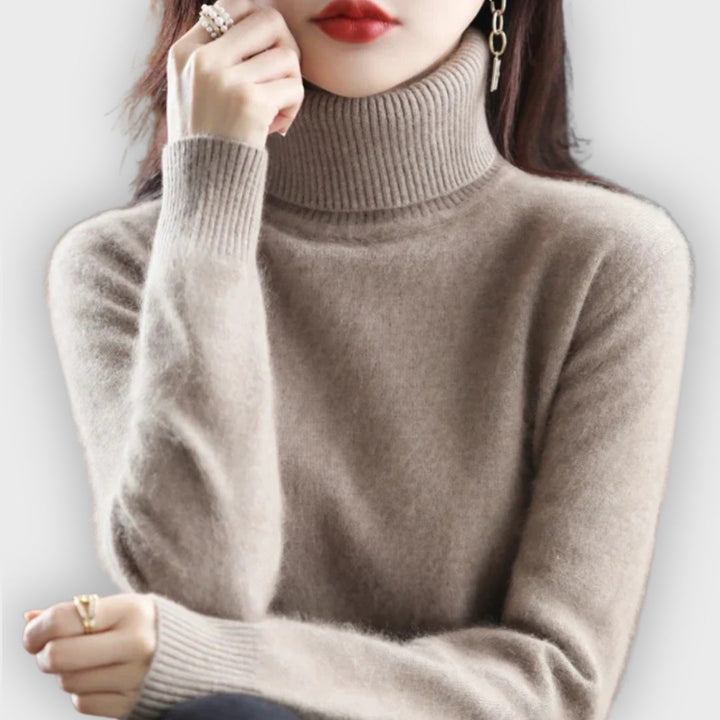 Luxurious women's roll neck sweater for ultimate winter warmth & style. Cozy knitwear.