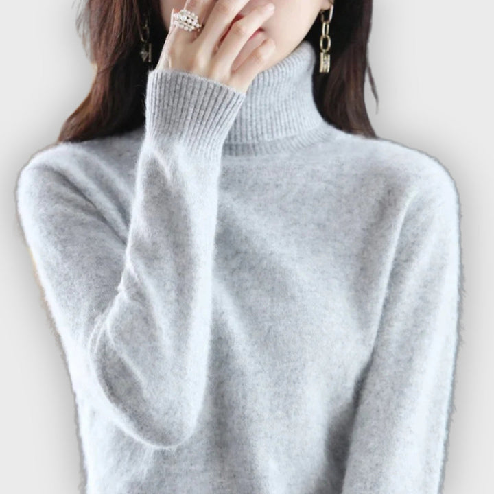 Elegant women's turtleneck sweater. Soft, comfortable, and warm, ideal for autumn & winter style.