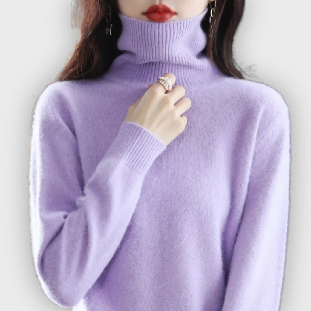 Women's cozy roll neck sweater, offering luxurious warmth and comfort for cold winter days.