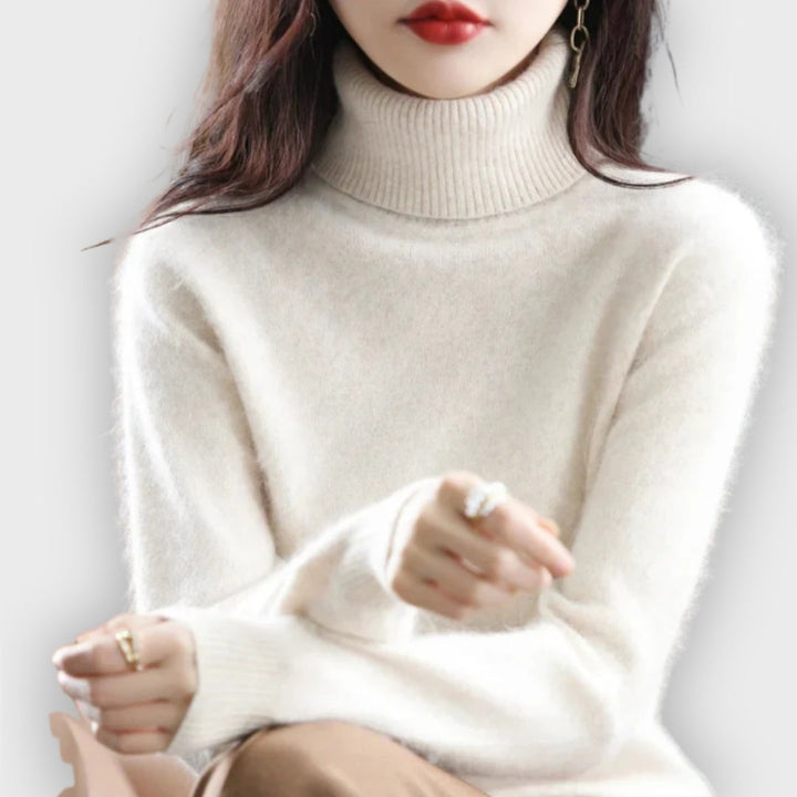Stylish women's roll neck sweater, perfect for cold weather. Warm, high-quality knitwear for women.