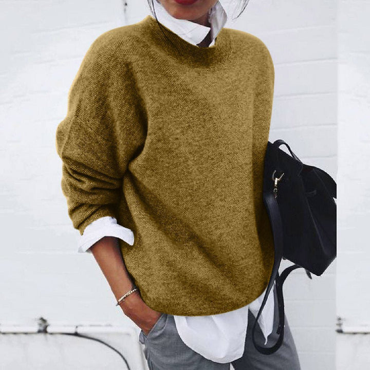 Luxurious women's timeless modern knit sweater. Versatile long sleeve pullover, perfect for fall & winter fashion.