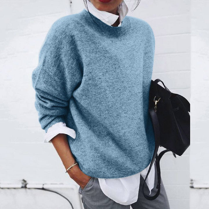 Close-up of elegant women's knitwear pullover. Features soft, modern knit texture, ideal for casual or chic outfits.