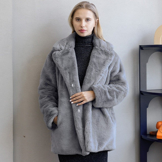 Luxurious women's winter coat, warm, stylish & versatile outerwear.