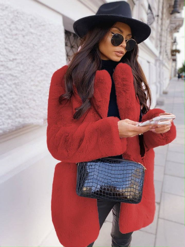 Elegant women's winter coat, long and cozy, ideal for stylish outerwear.