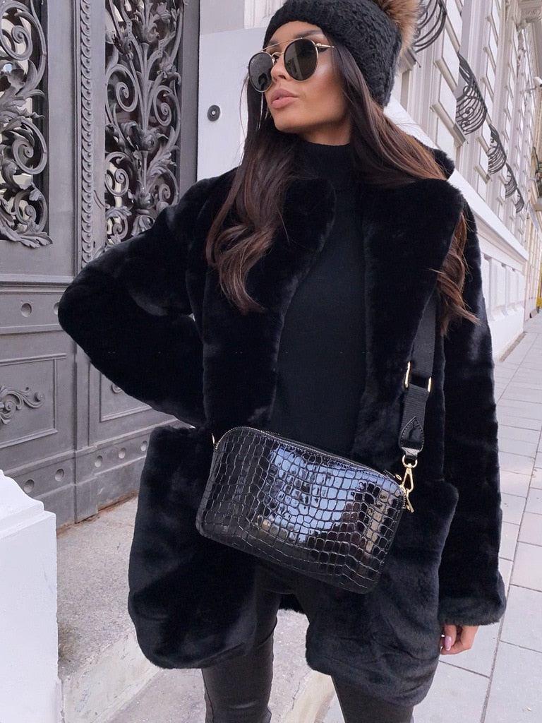 Warm women's jacket, luxurious design, perfect for winter fashion.