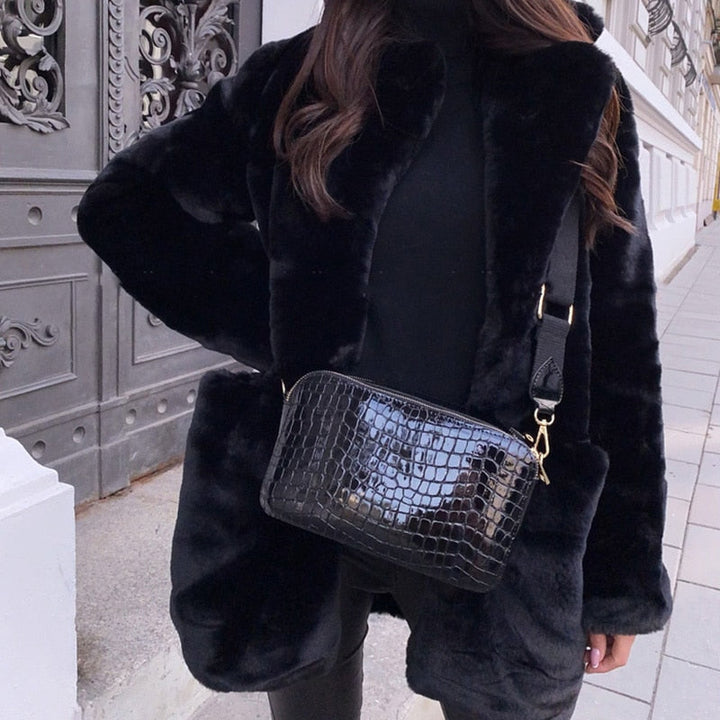 Fashionable women's winter jacket, luxurious & warm for cold weather style.