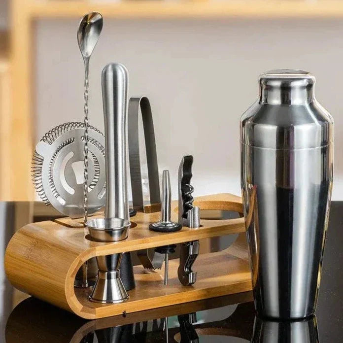 Crafting cocktails with luxury metallic 10-piece bar kit. Stainless steel mixology tools.