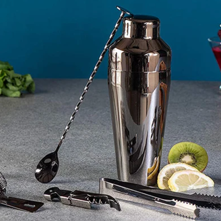 Polished metallic finish of luxury 10-piece cocktail bar kit. Stainless steel mixology tools.