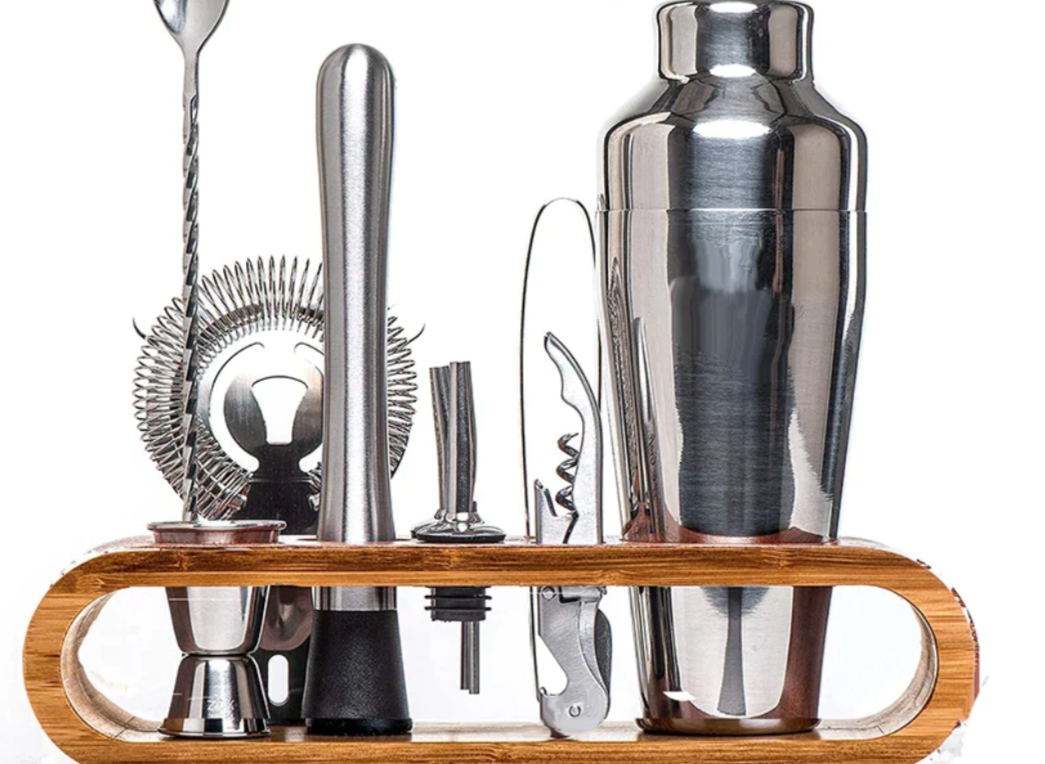 Precision metallic jigger and muddler from luxury 10-piece cocktail bar set.