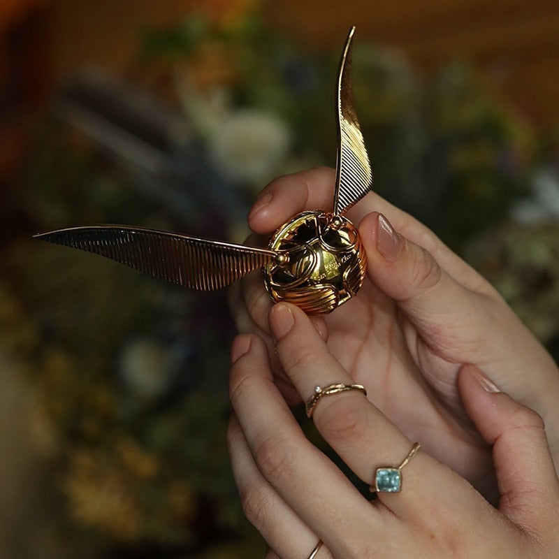 Handcrafted-look golden winged orb movable jewelry case, a collector's item & fantasy decor.