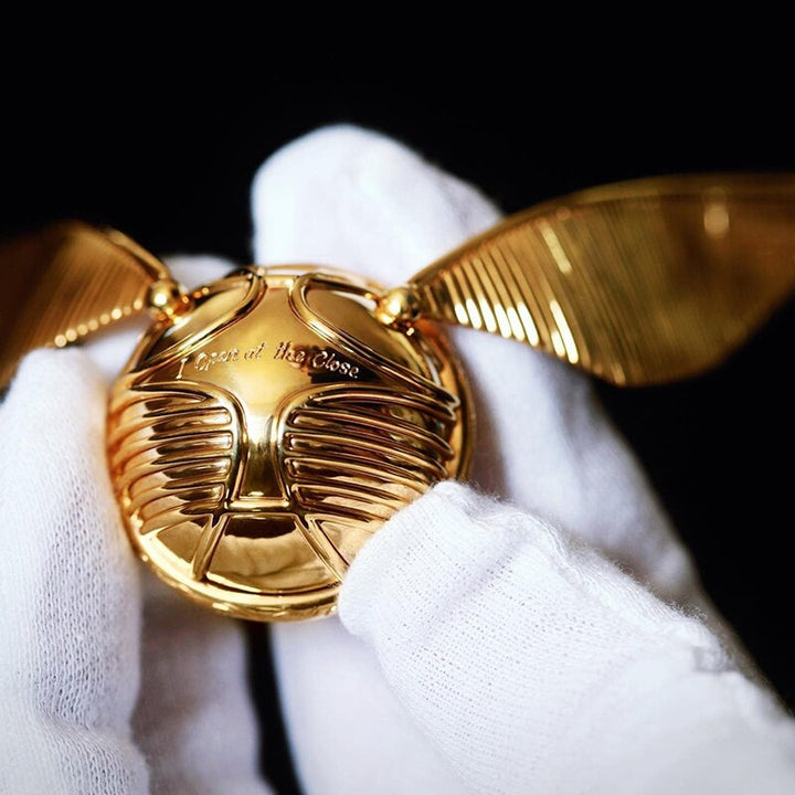 Stunning golden winged orb ring box, designed to protect & showcase engagement or wedding rings with luxury.