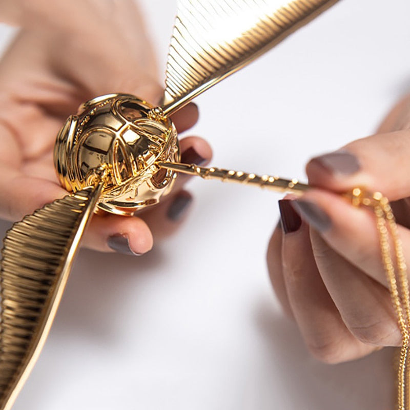 Exclusive luxury golden winged orb jewelry case, a unique keepsake box for your most cherished items & gifts.
