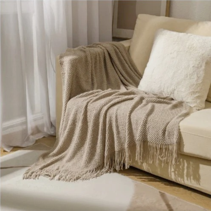 Soft, comfort acrylic throw blanket with tassels, ideal for modern home decor in bedroom.