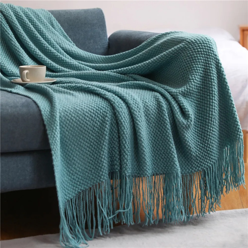 Premium acrylic throw blanket with elegant tassels, bringing luxury home decor to life.