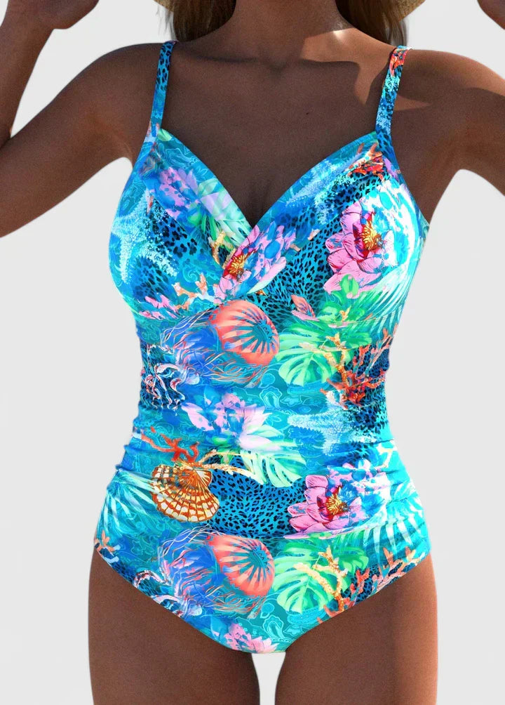 Luxury women's tropical print one-piece swimsuit, ideal for resort or beach vacation.