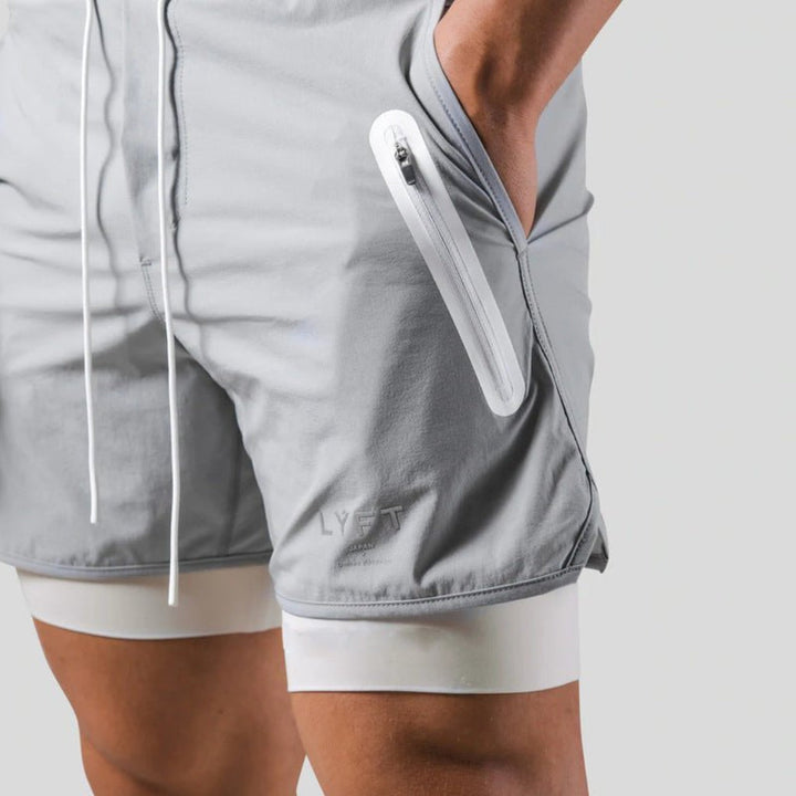Athletic men's 2-in-1 performance shorts with supportive compression lining for versatile training & exercise.